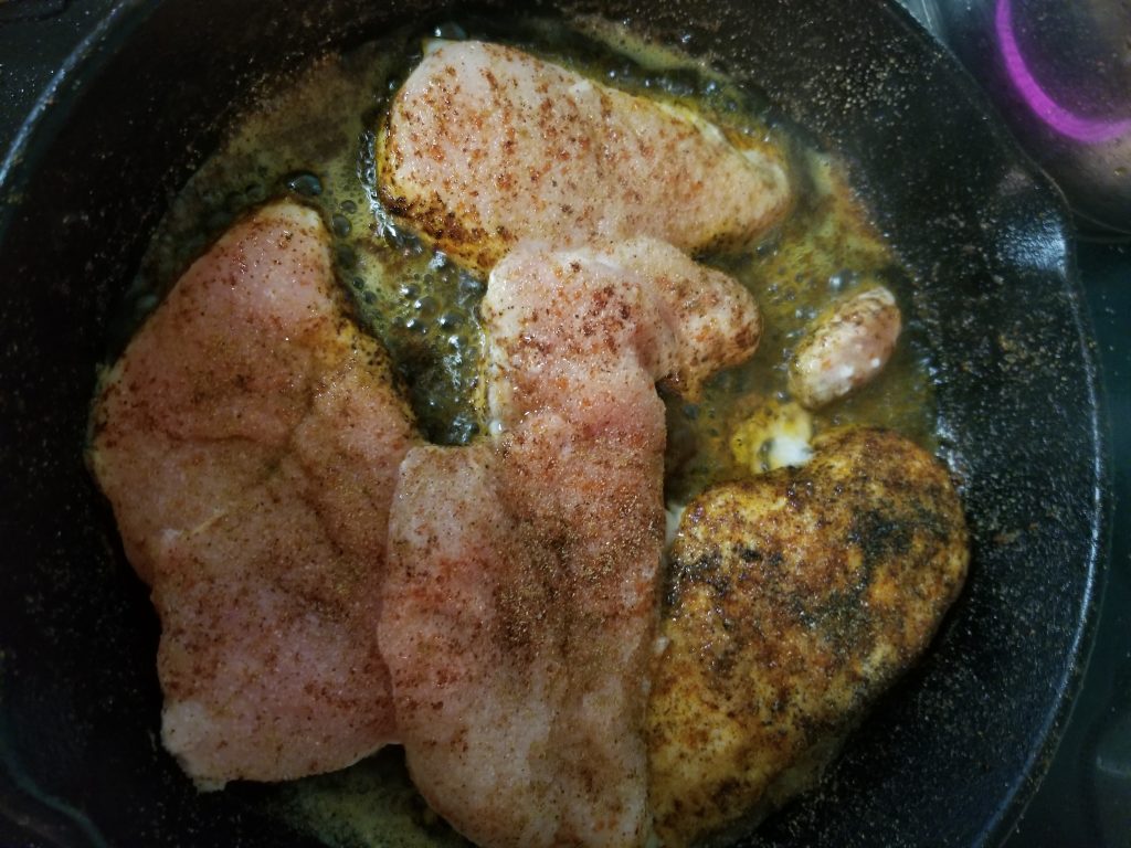 picture of chicken cooking in pan